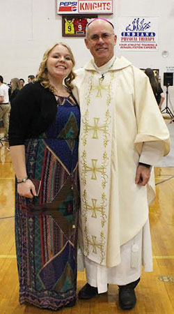 Alexander Broom , Bishop Luers senior, poses with Bishop Kevin C. Rhoades following her full reception into the Catholic Church on Jan. 28.