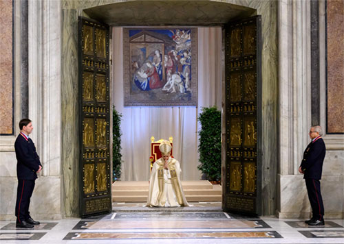 Pope Leo XIV kneels in prayer at the threshold of the Holy Door at St. Peter&rsquo;s Basilica before solemnly closing the door Jan. 6, 2026, marking the end of the Jubilee Year. (CNS photo/Vatican Media)