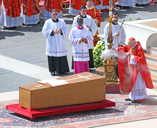 Cardinal Giovanni Battista Re, dean of the College of Cardinals, blesses the coffin as he leads the funeral Mass of Pope Francis in St. Peter's Square at the Vatican April 26, 2025. (OSV News photo/Vatican Media)
