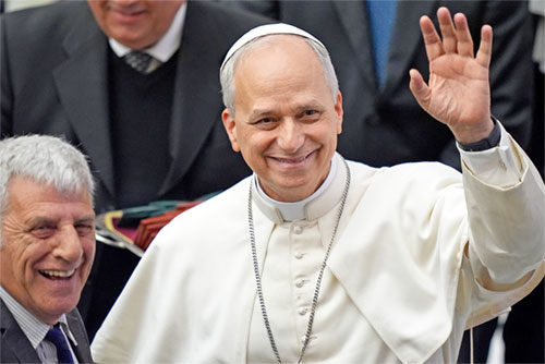 Pope Leo XIV, the former Cardinal Robert F. Prevost, waves to the crowds in St. Peter's Square at the Vatican after his election as pope May 8, 2025. The new pope was born in Chicago. (CNS photo/Vatican Media)