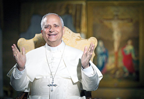 Pope Leo XIV laughs during a meeting livestreamed from the Vatican with 16,000 young people gathered at the National Catholic Youth Conference in Indianapolis on Nov. 21. (CNS photo/Vatican Media)