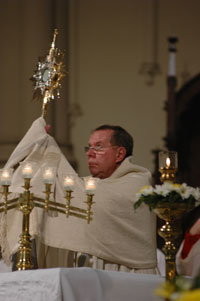 Archbishop adoring the Blessed Sacrament